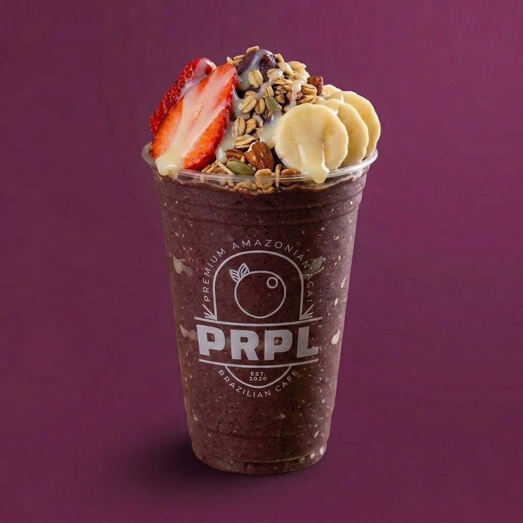 Açaí cup topped with fresh fruits and granola